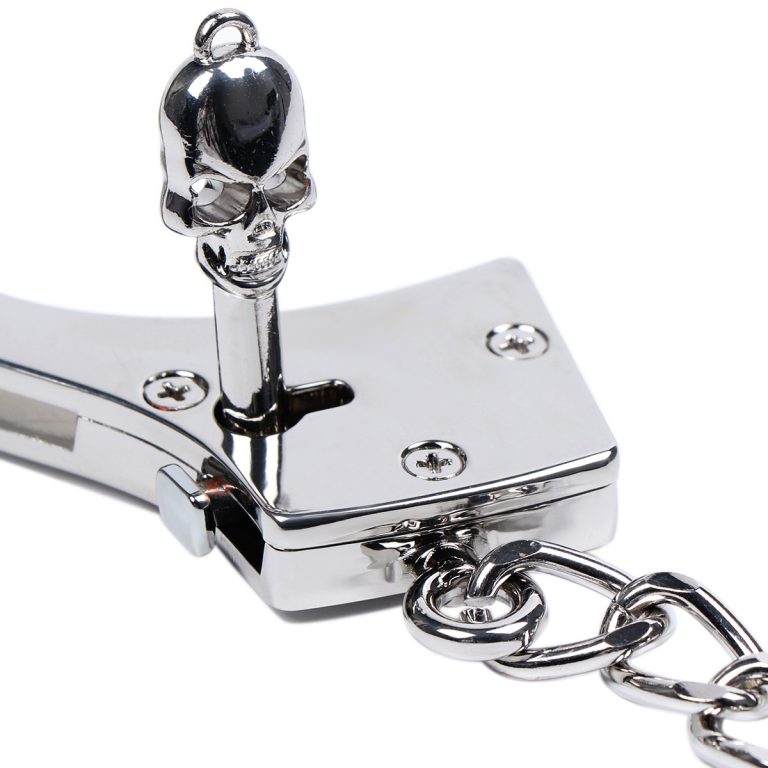 ready to open a silver stainless steel handcuffs use key