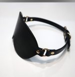 a black bdsm masks on table